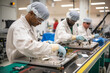 © aicandy - Dedicated workers in an aerospace manufacturing plant, assembling components for a satellite, generative ai