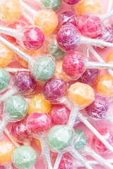 Sweet lollipops on pink background