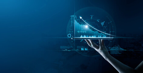 Leinwandbilder - Businessman holding digital tablet with data growth graph and progress of business and analyzing financial and investment information, business planning and strategy on blue background.