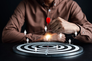 Fototapete - Customer Targeting the business concept, Businessman aiming red arrow dart to the target dartboard, Executive marketing, investment goal and target for planning development customer target group.