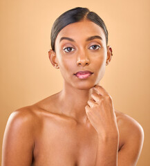 Sticker - Serious, beauty and portrait of a woman with makeup isolated on a studio background. Wellness, lifestyle and an Indian model with cosmetics promotion, feminine and looking elegant on a backdrop