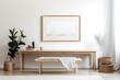 Mockup of a horizontal white frame on an antique wooden table and bench. With books and dried Lagurus ovatus grass, a contemporary white porcelain vase. white wall as a backdrop Scandinavian style dec