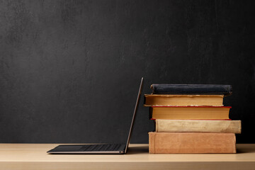 Wall Mural - Laptop and stack of books