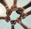 Hands, fist and unity with a sports team standing in a huddle for solidarity or motivation before a game. Fitness, teamwork and diversity with a group of men in a circle, getting ready for a match