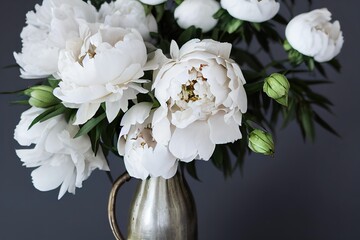 Poster - Bouquet of white peon flower with buds and leaves in metal vase on dark background., created with generative ai