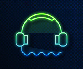 Canvas Print - Glowing neon line Headphones icon isolated on blue background. Support customer service, hotline, call center, faq, maintenance. Vector Illustration