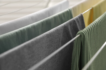 Canvas Print - Different apparel drying on clothes airer, closeup