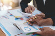 © Premreuthai - Business people meeting together showing graph and business growth and investment planning.