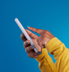 Poster - Phone, typing and hands of woman point to screen in studio for social media, text message and website. Communication, technology and girl on internet, networking and chat online on blue background