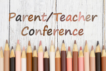 Parent Teacher Conference message with multiculture skin tone color pencils