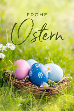 Fototapete - Happy Easter Card  - German text. Nest with Easter eggs in grass on a sunny spring day - Easter decoration, background  -  Copy space
