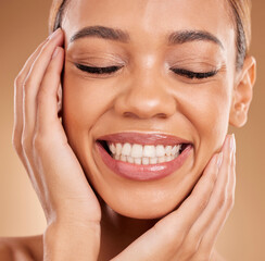 Poster - Smile, self love and hands on face of woman in studio for makeup, skincare and cosmetics on brown background. Closeup, beauty and happy girl model relax with natural and glowing skin while isolated