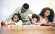 © Charlize D/peopleimages.com - Learning, writing and parents with children with homework, school activity and learning at home desk. Black family, education and mom, dad and kids with paper, drawing and crayon for teaching lesson