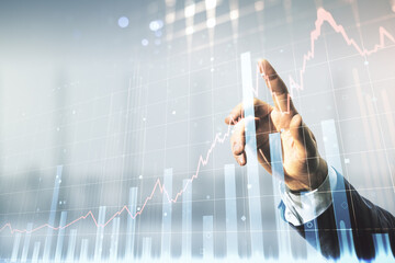 Wall Mural - Man hand presses on abstract virtual financial graph on blurred office background, financial and trading concept. Multiexposure