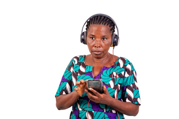 Wall Mural - portrait of a beautiful woman with cellphone and earphones.