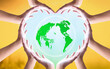 © paul - earth day concept, Heart shape of hands holding earth globe over blurred global warming background. Elements of this image furnished by NASA
