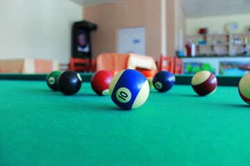 Game On: Billiard Table with Balls Mid-Game