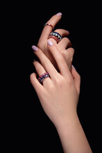Cropped View Of Young Woman Hands With Rings, Isolated On Black Background. Silver Ring On A Female Hand, Diamonds Diamond Ring In Hands Of Young Lady. Close-Up Photo Shoot. Adornment.