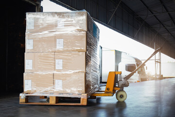 Package Boxes Wrapped Plastic Stacked on Pallets Loading into Cargo Container. Trucks Loading Dock Warehouse. Shipping Supply Chain Shipment. Freight Truck Logistics Cargo Transport	