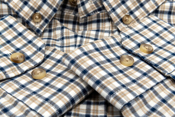 Wall Mural - Men's shirt. Plaid shirt sleeve with buttons. Piece of clothing. Button