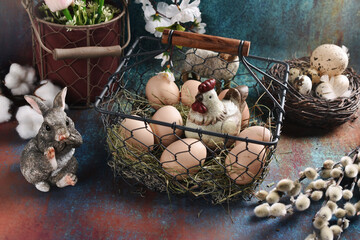 Sticker - Easter arrangement with eggs and a hen in wire basket on grunge background