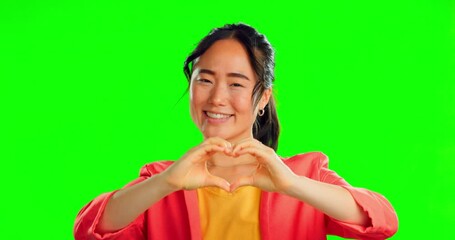 Wall Mural - Happy woman, heart hands and face on green screen, background and studio for care, kindness or emoji. Portrait, asian model and finger shape of love, thank you and smile of trust, peace and hope icon