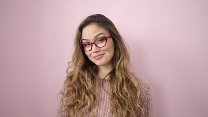 Wall Mural - Young beautiful hispanic woman smiling confident wearing glasses over isolated pink background