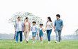 © Q88 - Asian family photo walking together in the park