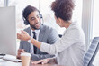 © Lune/peopleimages.com - Team, call center and talking at computer desk for support, advice or help with telemarketing sale. Happy man and woman consultant or agent online for CRM, customer service or contact us consultation