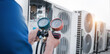 © Nonthanat - Technician is checking air conditioner,measuring equipment for filling air conditioners.