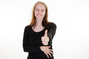 Wall Mural - beauty woman thumb up smiling cute blond girl in black shirt on white background