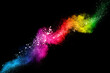 Pastel color dust particle splashing.Colorful powder explosion on black background.