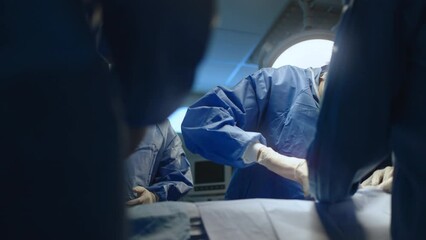 Wall Mural - team professional surgeons and nurses in uniform at work in operating room,performing heart transpla