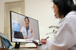 © weedezign - Asian woman doctor video conference discussion with doctor team about diagnosis patient symptom