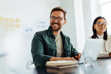 Poster - Happy business man listening to a discussion in an office