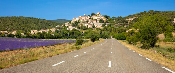 tour tourism in France,  road in provence and typical village with lavender field