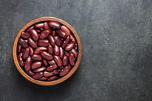 Top View Of Red Kidney Beans In Bowl On Black Background.
