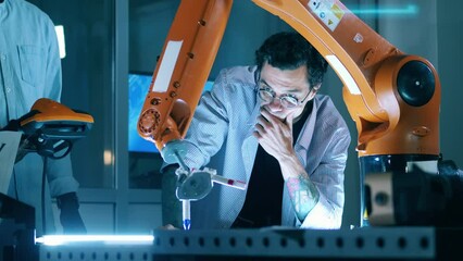 Wall Mural - researcher is discussing a robotic experiment with colleagues