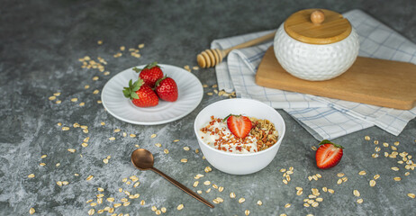 Wall Mural - Healthy food concept: homemade granola with yogurt and strawberries. Oatmeal with freeze-dried strawberries, fresh berries and honey. Delicious and healthy breakfasts. Banner, copy space for text