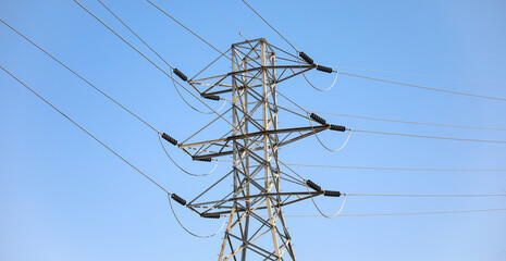 electrical power cable in landscape showing renewable green alternative energy showing steel generator infrastructure also depicting technological industry for electricity distribution at construction