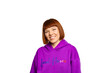 © Sotnikow - Smiling woman holding in a purple hoody
