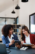 © Jirapong - Multiethnic business, Beautiful American African with asian businesswomans people in meeting. Accountant people do document, tax, exchange, accounting and Financial advisor