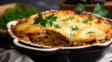 Hearty Greek Moussaka - Layers Of Rich Flavor With Eggplant, Potatoes, Seasoned Ground Meat, And Creamy Béchamel Sauce, Baked To Perfection