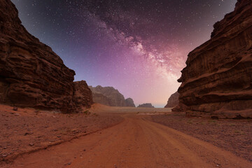 Wall Mural - Wadi Rum desert, Jordan, The Valley of the Moon. Orange sand, Milky Way sky.