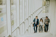 © BGStock72 - Group of corporate business professionals climbing at stairs in office corridor