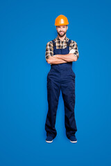 Wall Mural - Full size fullbody portrait of cheerful joyful repairer in shirt and overall, having his arms crossed, looking at camera, isolated on grey background