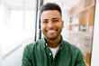 © Vadim Pastuh - Close-up portrait of a happy indian young man with friendly wide toothy smile, latin guy wearing casual ggreen shirt looks into camera, employee profile photo