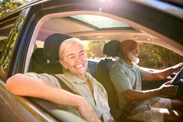 Wall Mural - Senior Couple Enjoying Summer Day Trip Out Driving In Car Together