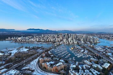 Wall Mural - Aerial shot of the beautiful Vancouver city in Canada with many skyscrapers during the winter