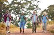 © Monkey Business - Group Of Active Senior Friends Enjoying Hiking Through Countryside Walking Along Track Together